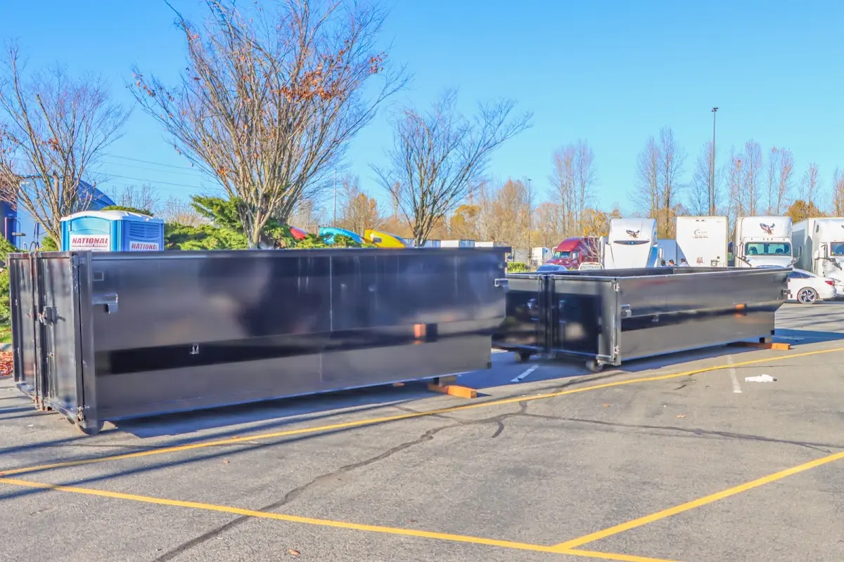 Professional dumpster rental service with roll-off container on residential driveway in Walnut Creek